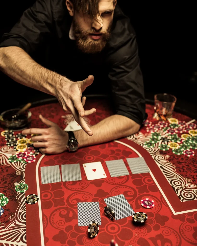 bearded man throwing poker chips