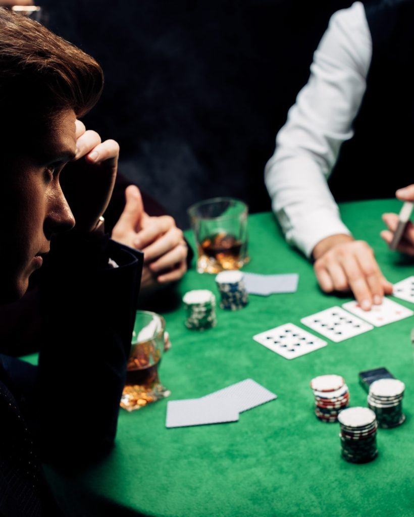 elective focus of man playing poker